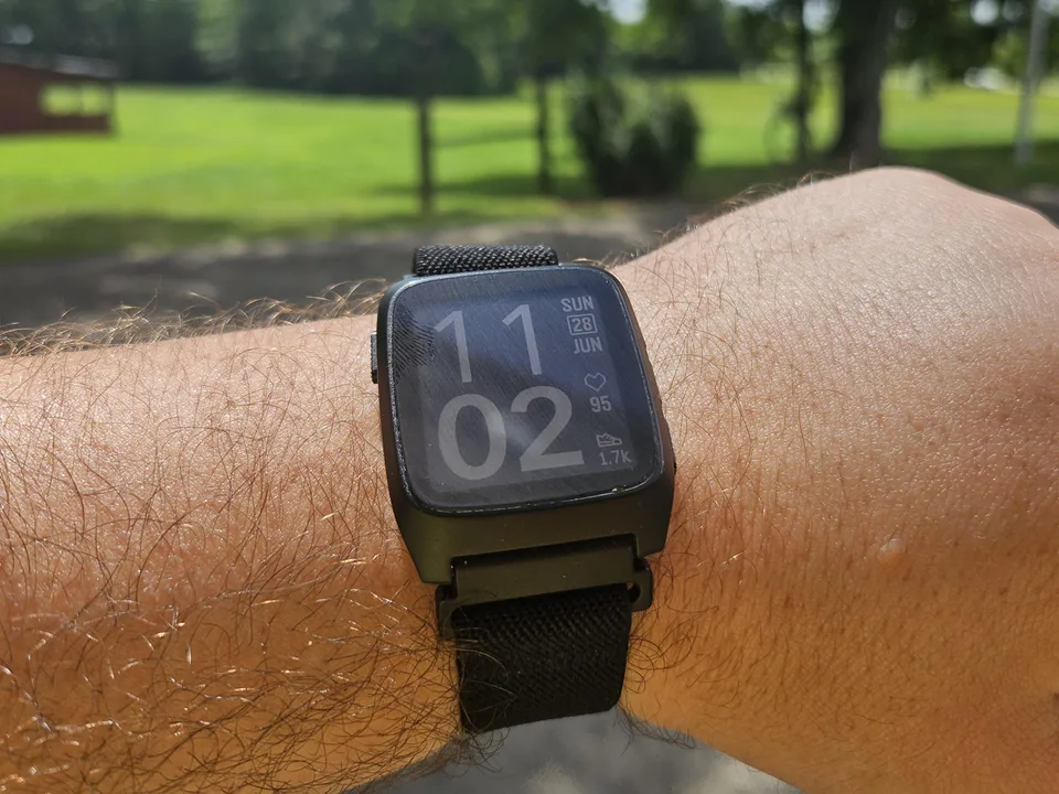 Pebble Time 2 with a black elastic nylon Solace band worn outdoors